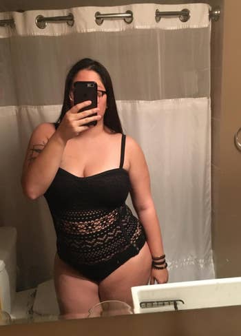 reviewer wearing lace bathing suit in black in mirror selfie