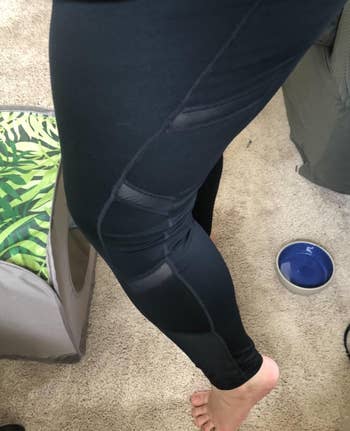reviewer showing the closeup mesh detailing on the side of the leggings