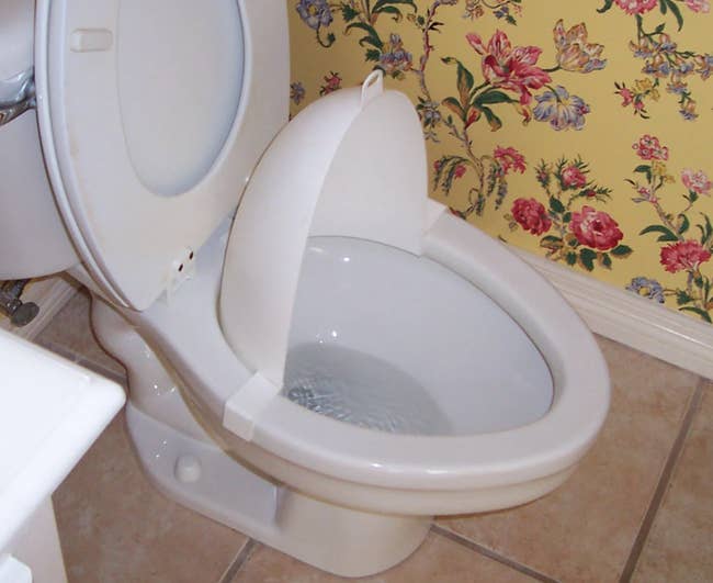 The splash guard on a toilet bowl