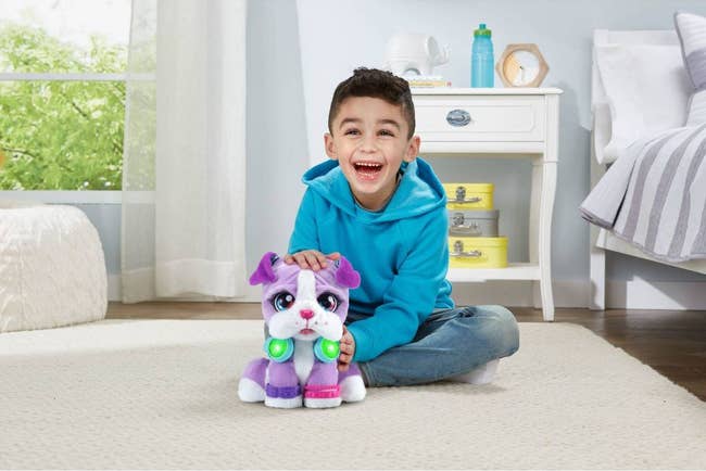 an image of a child playing with the purple toy