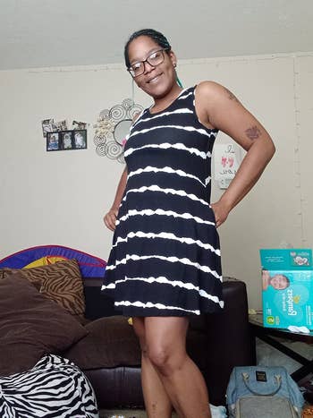 Reviewer wearing black and white striped dress