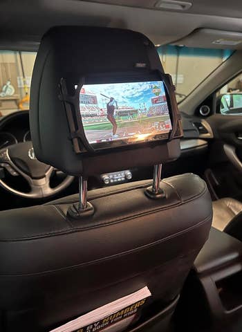a Nintendo Switch wrong of a headrest equine wrong of a car