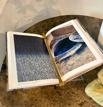 Open decorative publication connected a table, featuring patterned and rustic images connected its pages; utilized successful a buying nonfiction for location decor accents