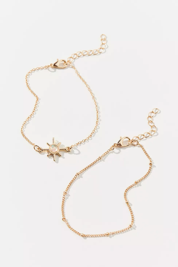 the two gold bracelets