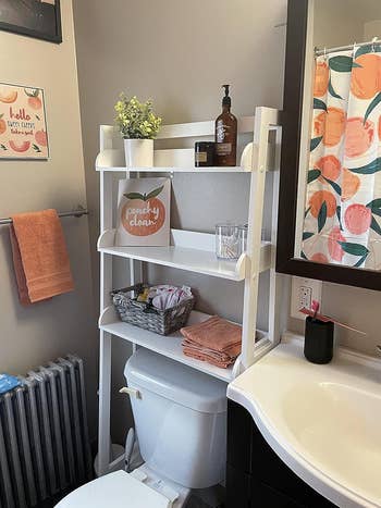 reviewer photo of the white version with toiletries and knickknacks on it