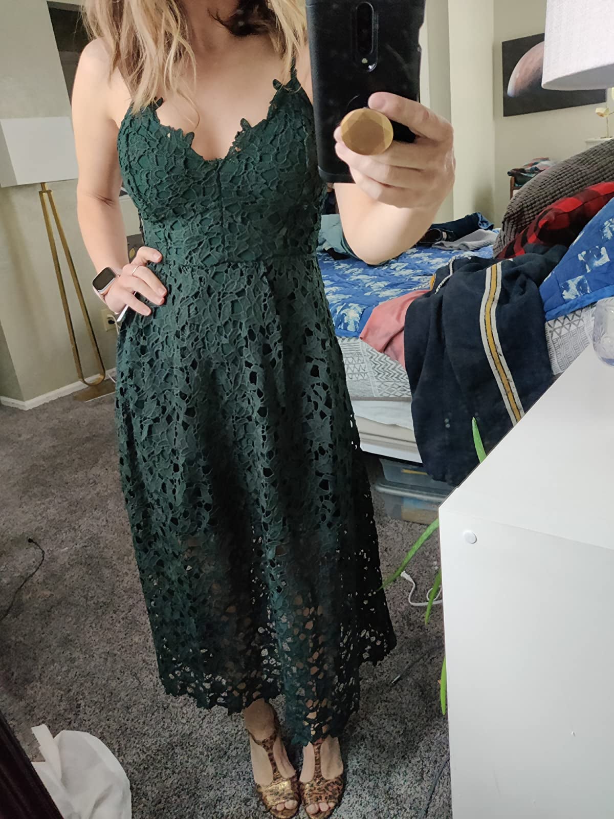 reviewer wearing the lace dress in green