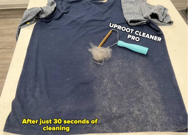 Shirt covered half in pet hair and half clean with an uproot cleaner showing a large clump of hair