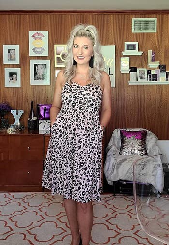another reviewer wearing the leopard print sundress in a medium