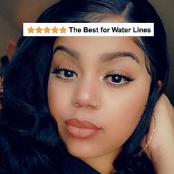 A reviewer wearing white eyeliner on their water line with five star review text 