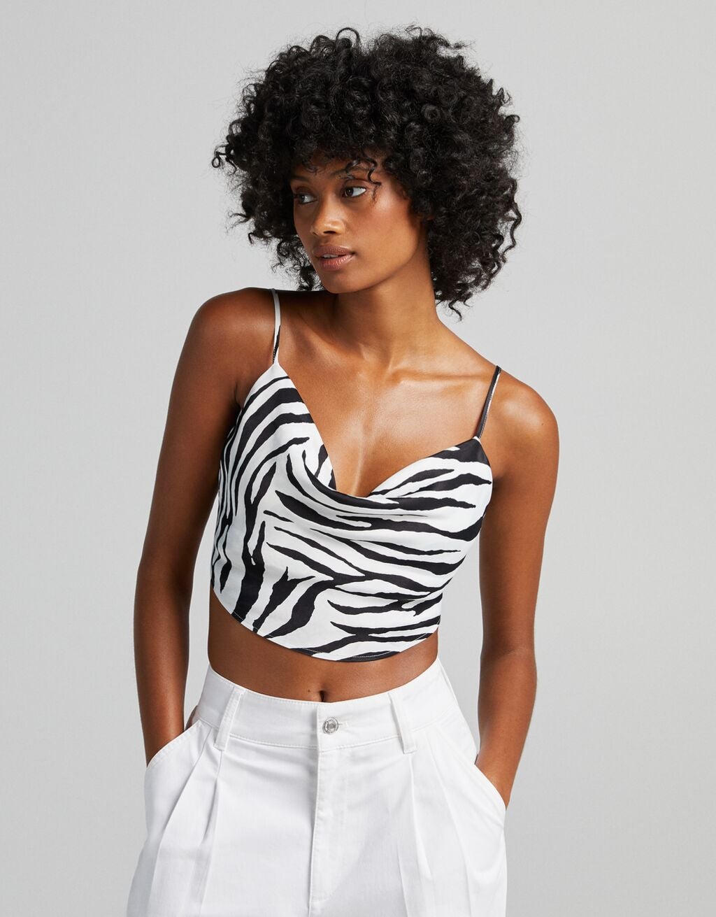 model wearing zebra print crop top