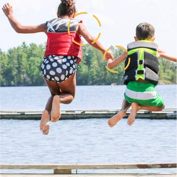 two kids jumping into water with stickers circled 