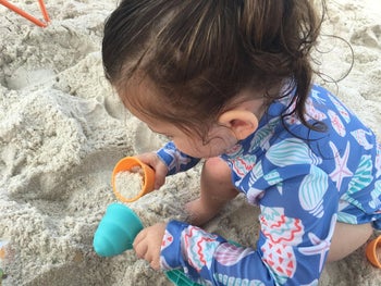 reviewer's child playing with the sand toys