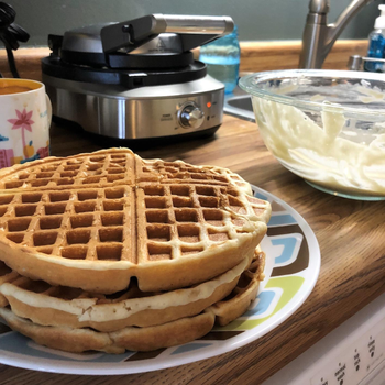 Reviewer image of waffles and black and silver waffle maker