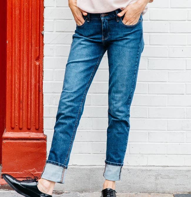 model wearing the boyfriend jeans, cuffed at the bottom