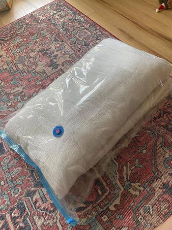 before of comforter in vacuum bag with air still inside