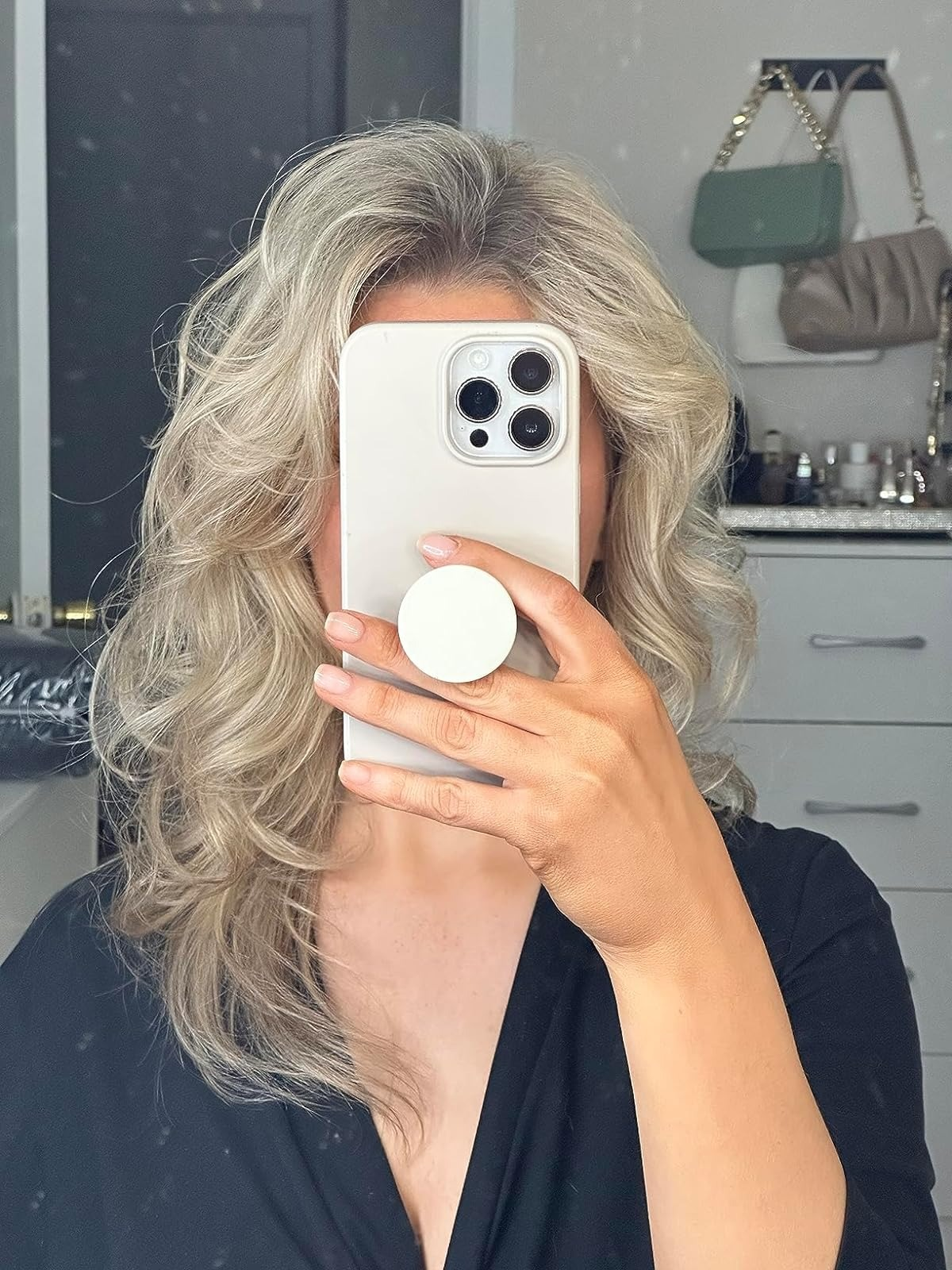 reviewer with styled wavy hair