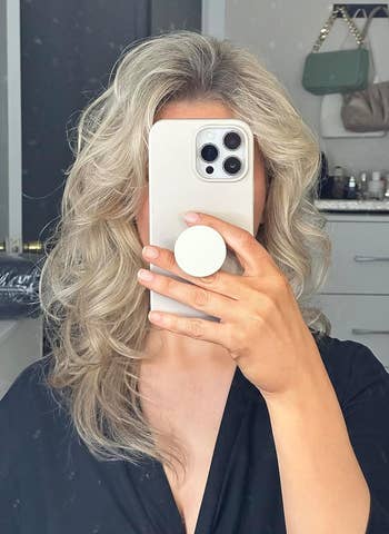 reviewer with styled wavy hair