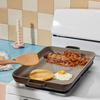 the grey pan being used as a griddle