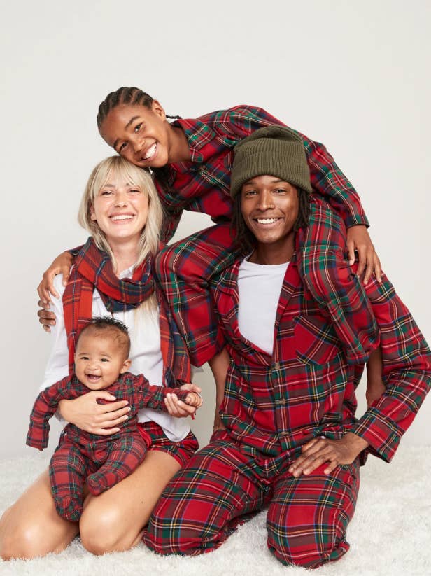 a family in red and green tartan pajamas