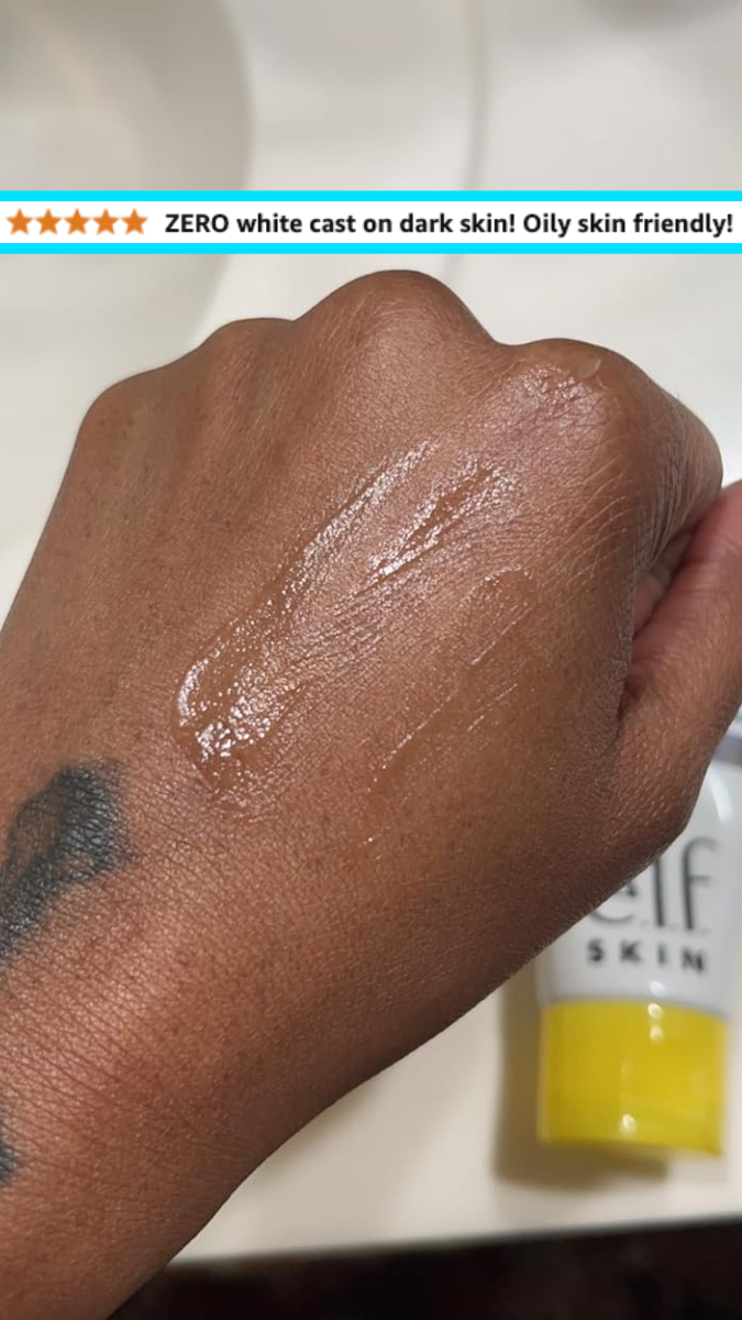reviewer showing the sunscreen applied to dark skin, leaving no white cast