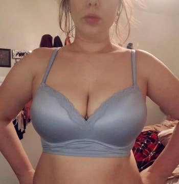 reviewer photo of them wearing the bra in blue