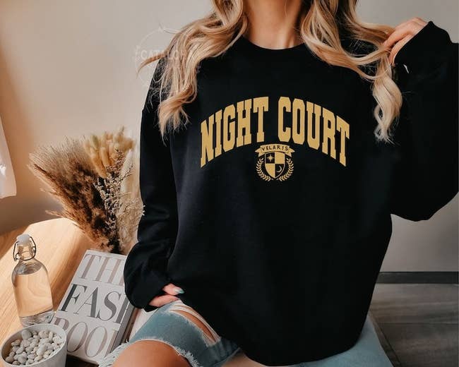 model in a 'Night Court' sweatshirt