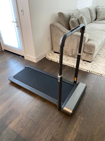 reviewer photo of unfolded treadmill with handbar