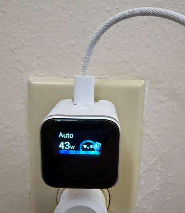 Wall outlet with a integer charger displaying