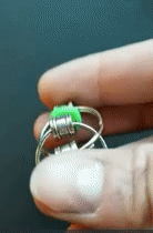 GIF of reviewer playing with green fidget chain