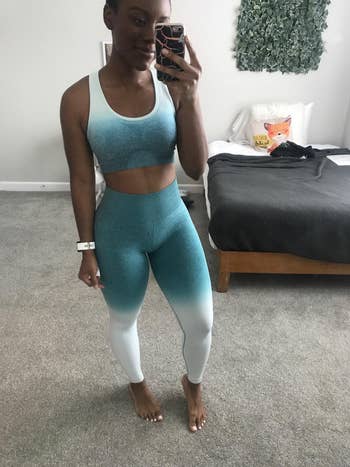 reviewer in ombre white and blue sports bra and leggings