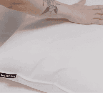 gif of model pressing down on the pillow 