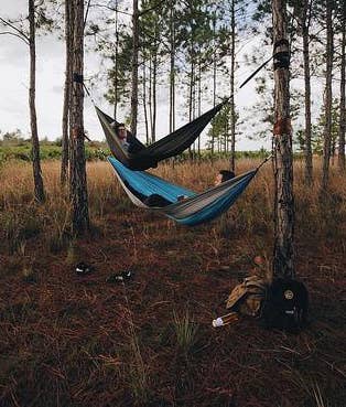 two reviewers each in their own hammock on top of each other
