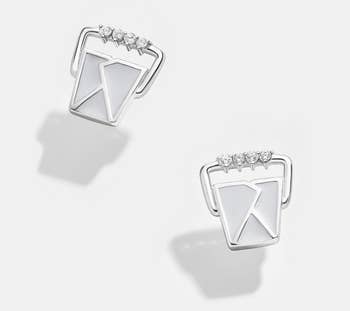 silver tone earrings shaped like takeout boxes with four jewels on the handles