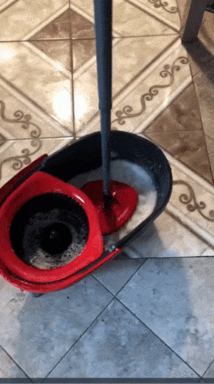 gif of reviewer using mop and spinner 
