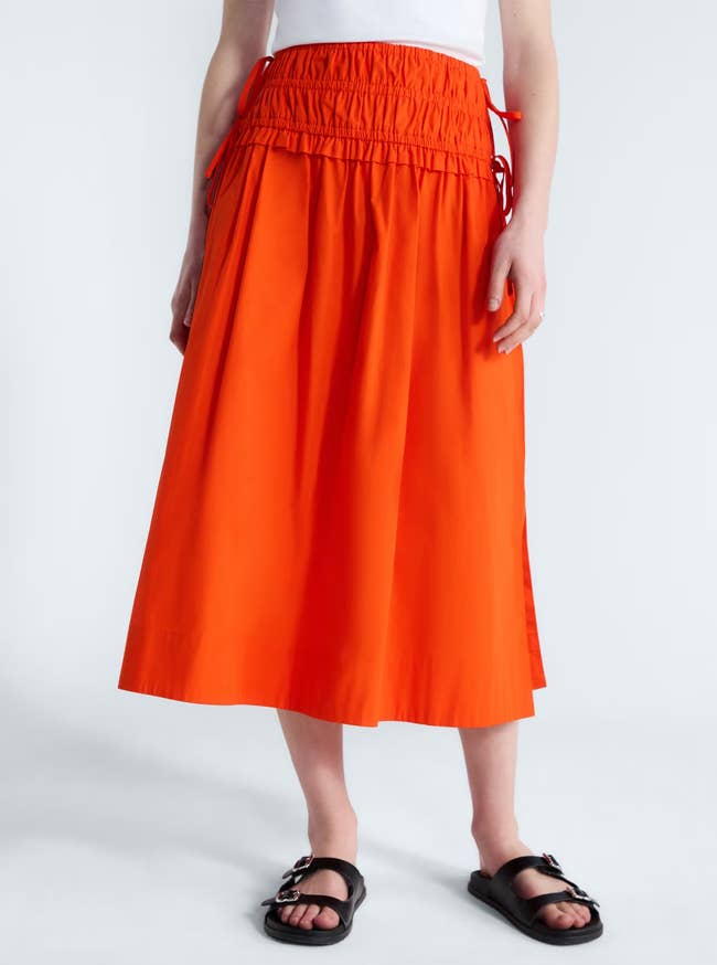 A adjacent up of the skirt worn by a model