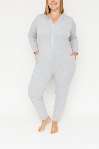 front view of a model in the grey hooded jumpsuit