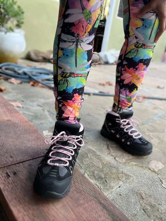 A close up of the shoes worn by a reviewer