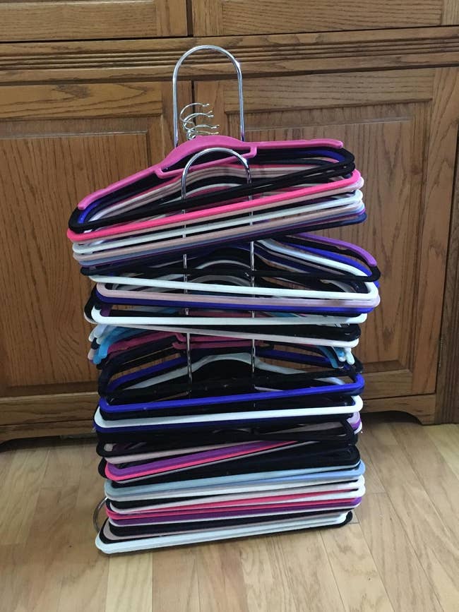 a bunch of hangers organized on a stacker