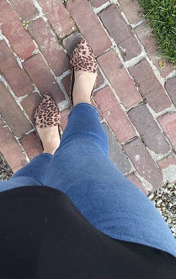 Close up of a different reviewer wearing the same loafer but in leopard print