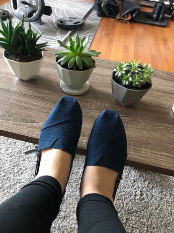 reviewer wearing bluish  tom's slip-ons