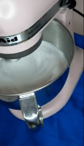 reviewer gif of the pink mixer whipping meringue