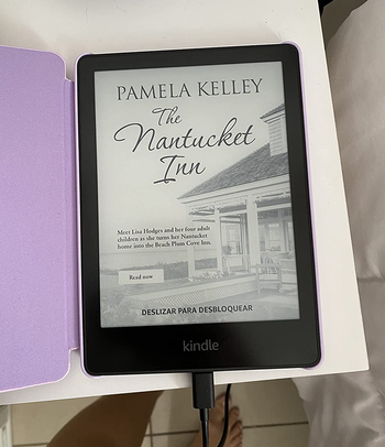 reviewer photo of a kindle showing a book cover