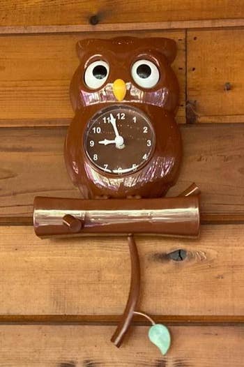 reviewer photo of the owl clock on a wall