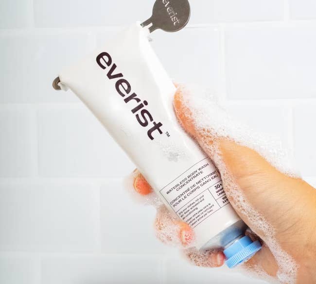 Model holding tube of body wash concentrate 