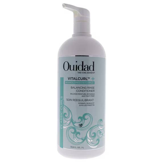 Bottle of Ouidad VitalCurl+ Balancing Rinse Conditioner, 33.8 fl oz, with substance   emphasizing curl care