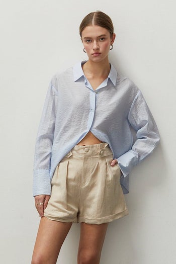 same model wearing the shorts in beige