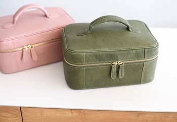 green and pink leather toiletry bags