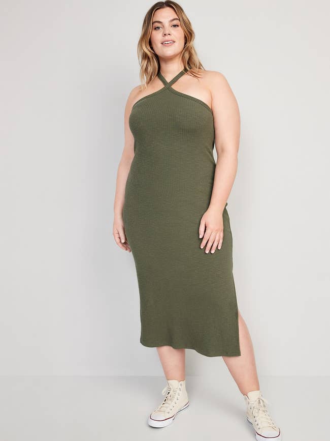 model wearing the ribbed dress in olive green