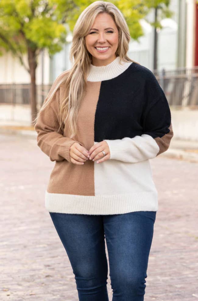 model wearing not without you sweater in taupe with jeans