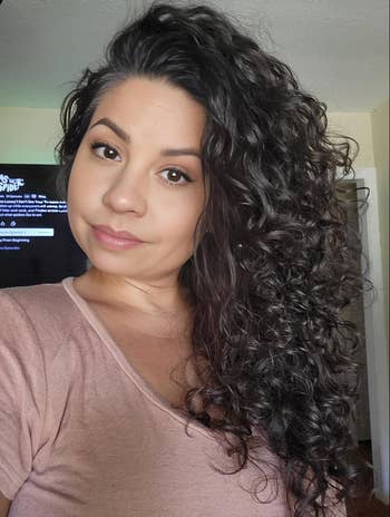 reviewer with wavy, voluminous hair 